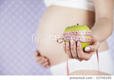 Apple, Pregnancy woman, healthy lifestyle concept Apple, Pregnancy woman, healthy lifestyle concept 33740200