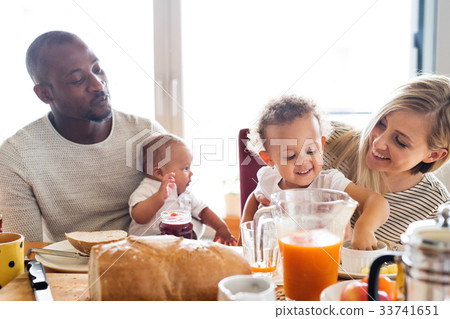 Young interracial family with little children 33741651