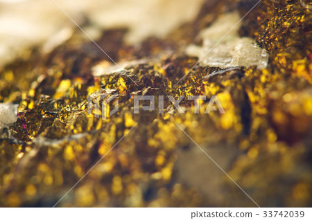 Golden background from natural mineral. Macro Golden background from natural mineral. Macro 33742039