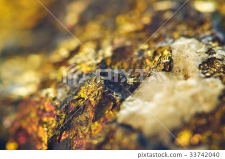 Golden background from natural mineral. Macro Golden background from natural mineral. Macro 33742040