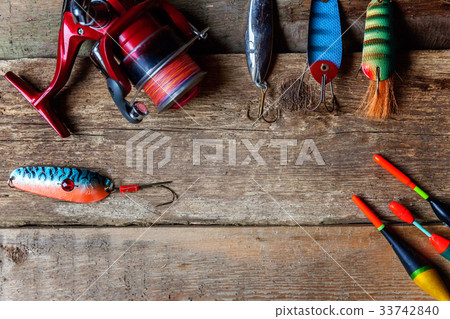 fishing tackle on a wooden surface 33742840
