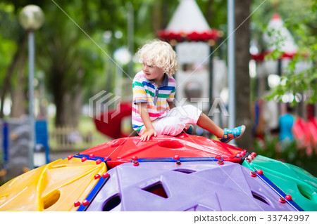 Child on school playground. Kids play. 33742997