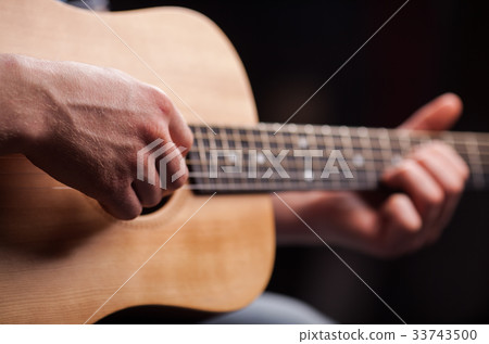 Acoustic guitar player 33743500