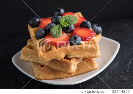 Waffles with berries. Waffles with berries. 33744893