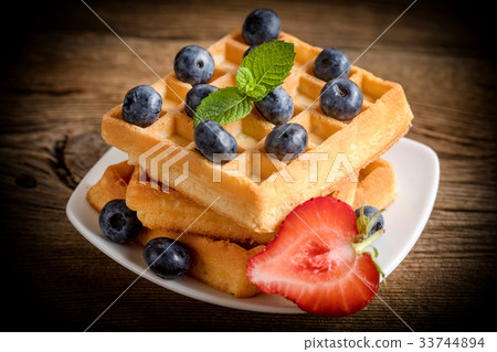 Waffles with berries. Waffles with berries. 33744894