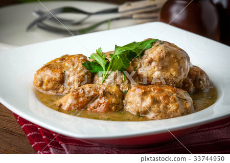 Pork meatballs with dill sauce. 33744950
