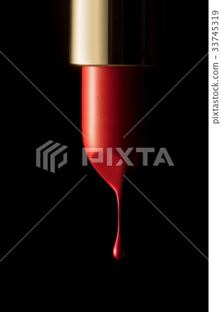 Red lipstick on black background Red lipstick on black background 33745319