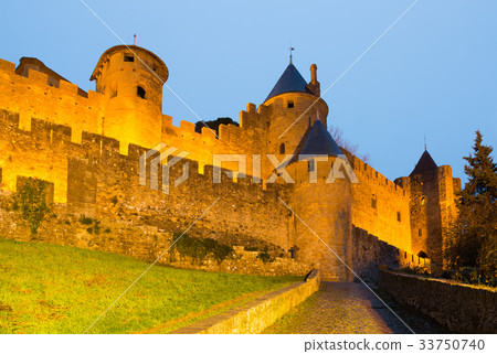 Old fortress walls in twilight time. Carcassonne 33750740