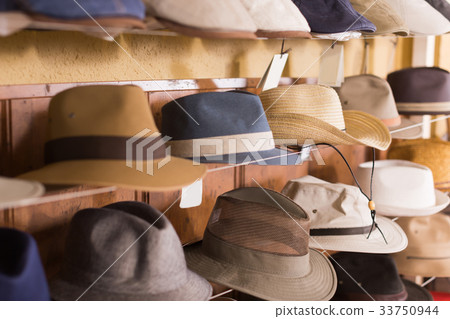 Sun hats hanging on the shelf Sun hats hanging on the shelf 33750944