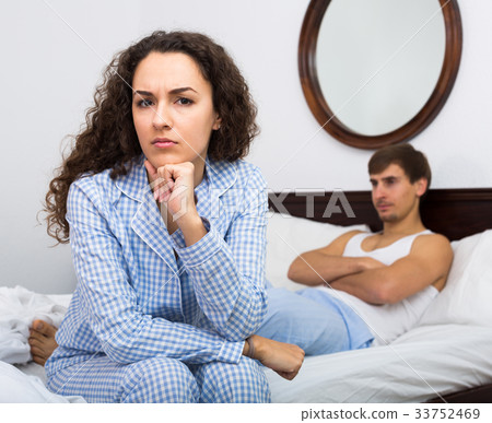 Young couple having quarrel in bedroom Young couple having quarrel in bedroom 33752469