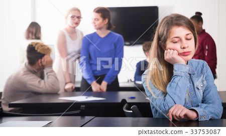 young girl student feeling uncomfortable at break between classes 33753087