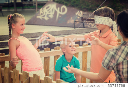 Boys with girlfriends are playing in blindfolders 33753766
