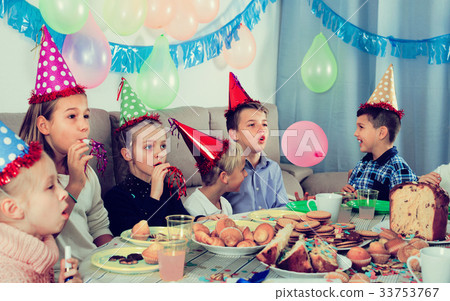 Boys and girls happy to see each other during Christmas dinner 33753767