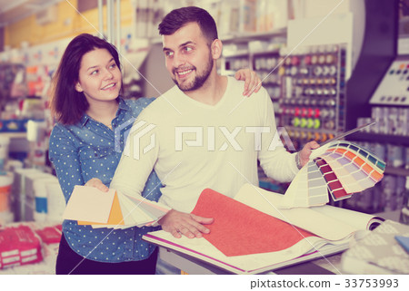 Couple examining color scheme variants Couple examining color scheme variants 33753993