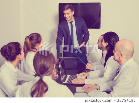 Manager making speech during business meeting 33754185