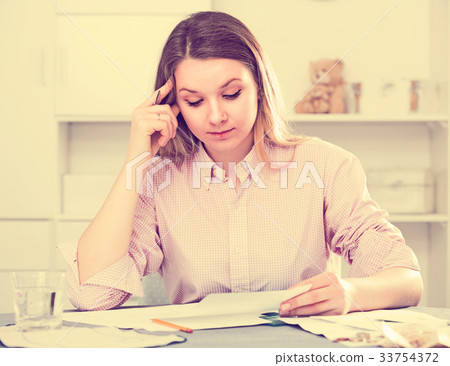 Adult female is signing profitable financial agreement Adult female is signing profitable financial agreement 33754372