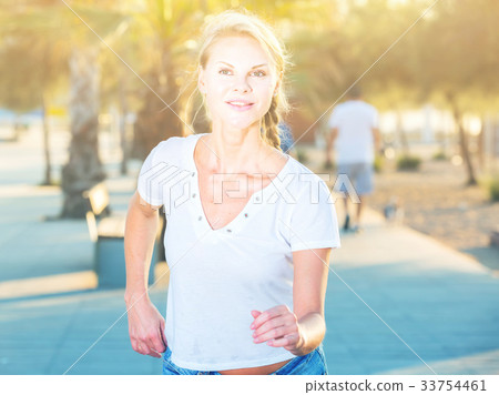 Sportswoman is jogging in the park Sportswoman is jogging in the park 33754461