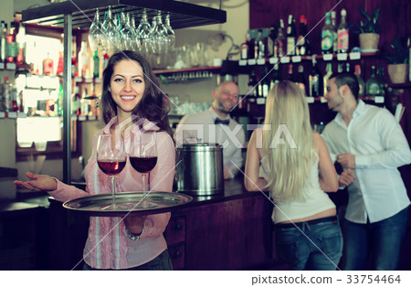 Portrait of smiling waitress 33754464