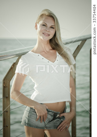 Female is posing on pirce in her free time Female is posing on pirce in her free time 33754484