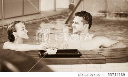 Couple is drinking champagne while resting 33754689