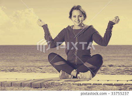 girl exercising on exercise mat outdoor 33755237