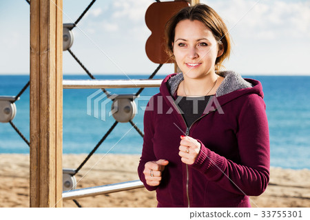 Young woman running in beach Young woman running in beach 33755301