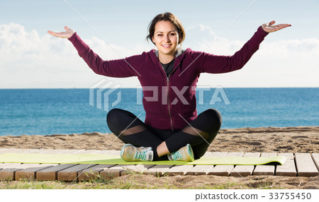 girl exercising on exercise mat outdoor 33755450