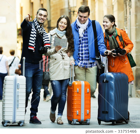 Two couples reading city map 33755466