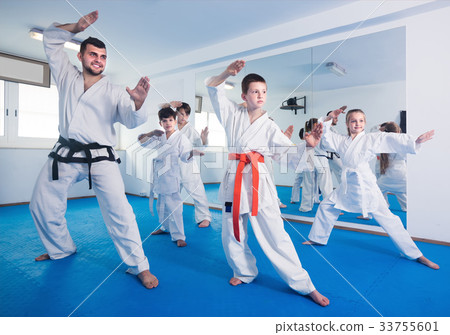 Young children attempting to master new moves 33755601