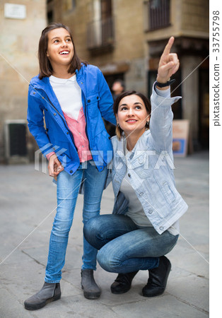 Young mother and daughter paying attention to sight 33755798