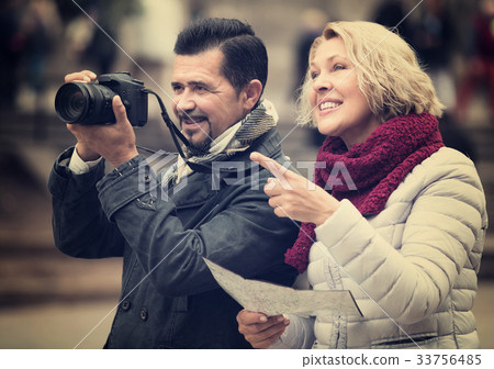 Mature tourists couple outdoor. 33756485