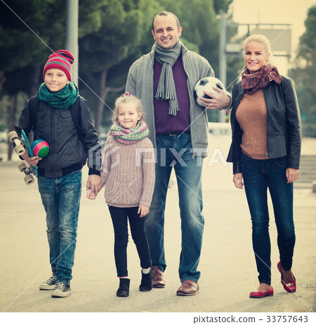 Portrait of family with two kids outdoors. Portrait of family with two kids outdoors. 33757643