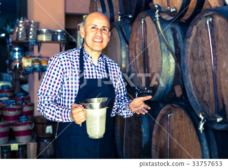man holding wine in wine house man holding wine in wine house 33757653