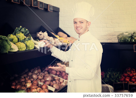 Man cook deciding on best vegetables Man cook deciding on best vegetables 33757659