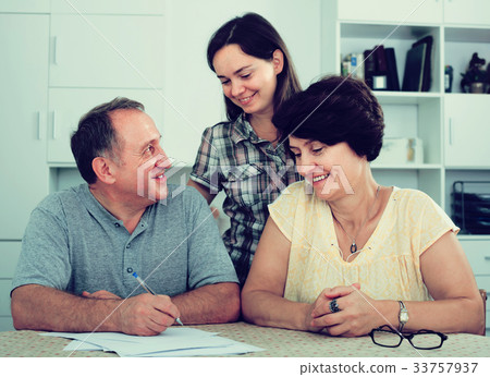 Cheerful man and woman signing documents 33757937