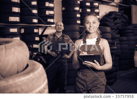 girl in workwear in auto mechanic workshop. girl in workwear in auto mechanic workshop. 33757958