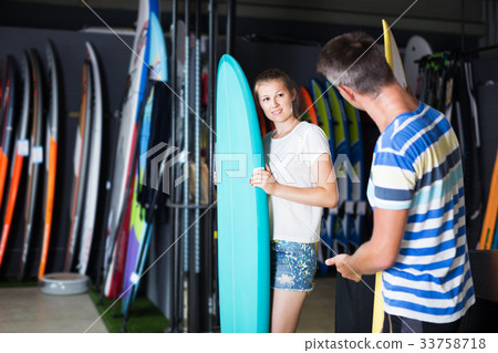 Female showing to male surfboard Female showing to male surfboard 33758718