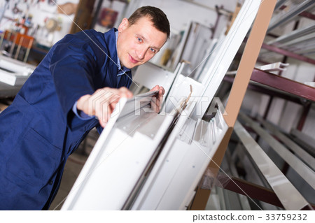 Ordinary workman inspecting PVC manufacturing Ordinary workman inspecting PVC manufacturing 33759232