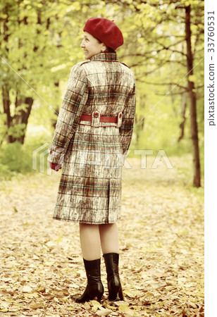 senior woman walking outdoors 33760531