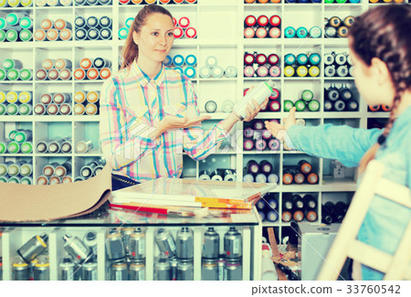 Mother and daughter holding spray 33760542