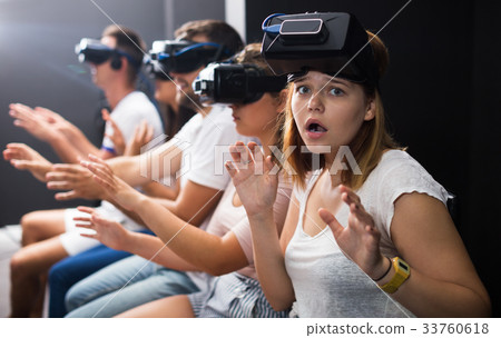 Girl wearing virtual reality goggles Girl wearing virtual reality goggles 33760618