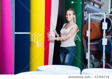 female looking at carpet flooring 33760728