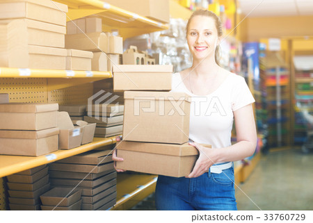 Smiling girl with gift boxes Smiling girl with gift boxes 33760729