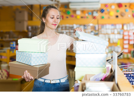 Ordinary girl chooses accessories for gift 33760783