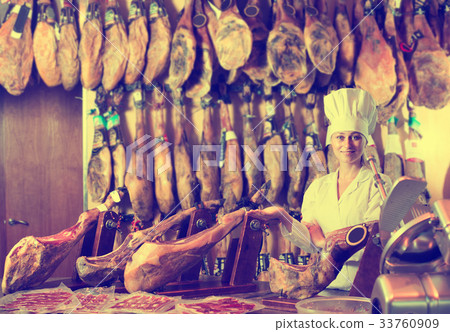 woman in uniform working with meat woman in uniform working with meat 33760909