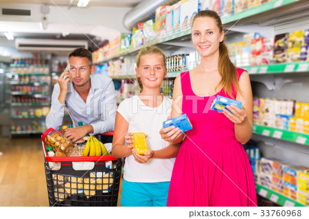 frustration man with family in supermarket frustration man with family in supermarket 33760968