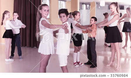 Positive children are dancing tango Positive children are dancing tango 33760984