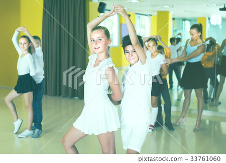 Positive kids are dancing rock-n-roll in pairs Positive kids are dancing rock-n-roll in pairs 33761060