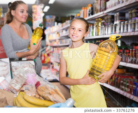 Girl teen is demonstrating chosen purchases Girl teen is demonstrating chosen purchases 33761276