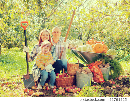 Happy parents and child in garden 33761325